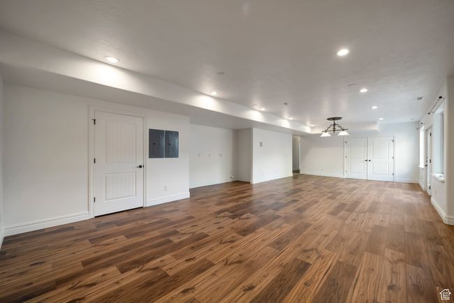 Unfurnished living room with recessed lighting, dark wood finished floors, and baseboards | Image 28