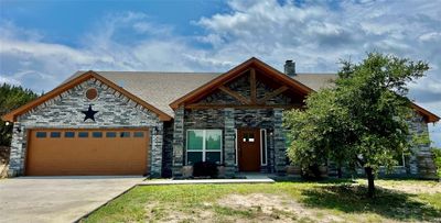 View of front facade with a garage | Image 2