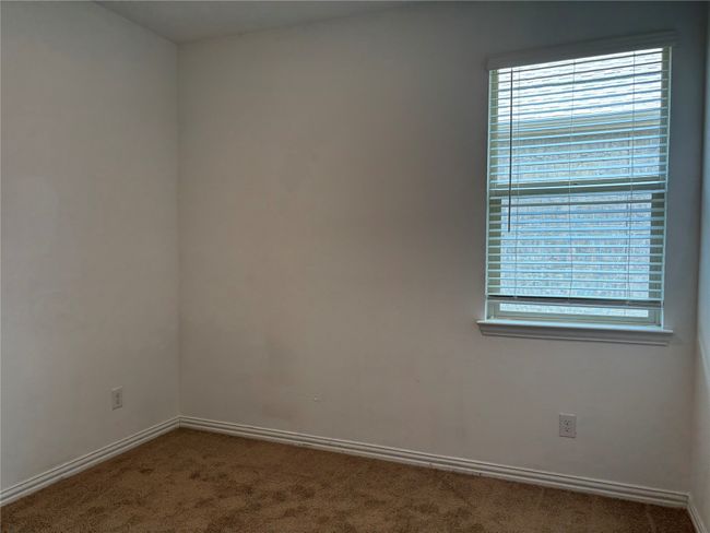 Carpeted empty room featuring baseboards | Image 16