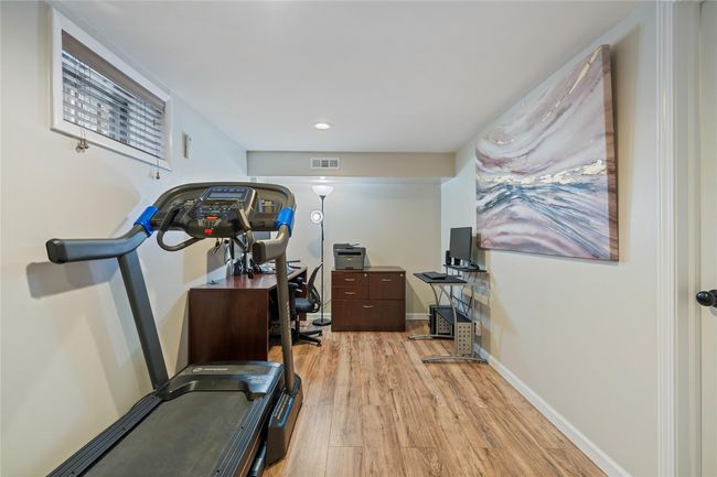 Exercise area featuring baseboards, visible vents, recessed lighting, and light wood-style floors | Image 32
