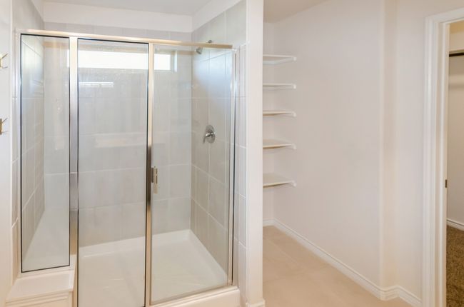 Full bathroom featuring a stall shower and tile patterned floors | Image 14