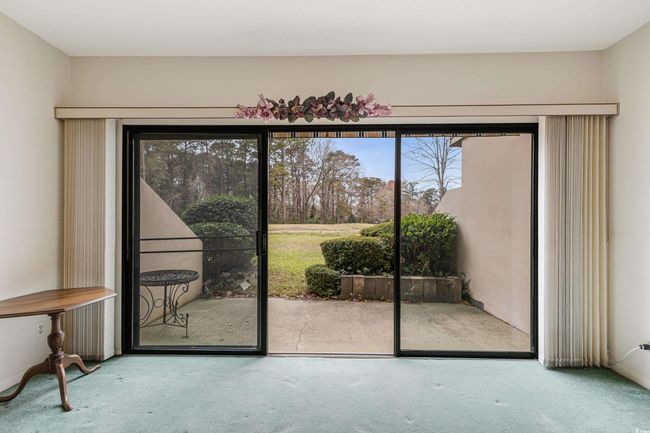 View of carpeted spare room | Image 15