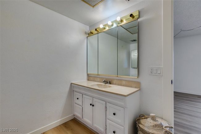 Bathroom featuring wood finished floors and vanity | Image 35