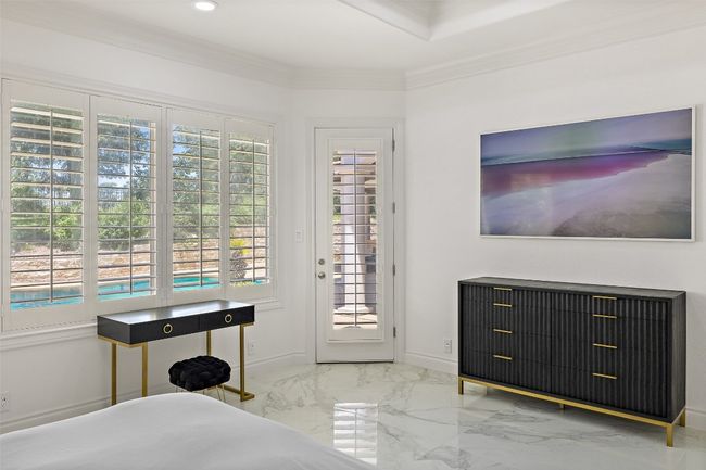 Bedroom featuring marble tiled flooring, crown molding, baseboards, access to exterior, and recessed lighting | Image 18
