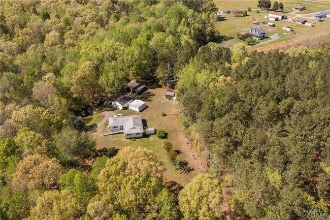 Birds eye view of property featuring a forest view | Image 34