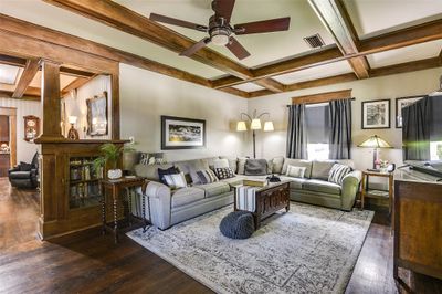 Living room with coffered ceiling, beam ceiling, ceiling fan, and dark hardwood / wood-style floors | Image 2