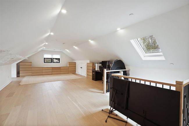 Additional living space featuring light wood-style floors and lofted ceiling with skylight | Image 28