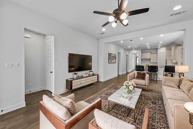 Living room featuring ceiling fan, dark wood finished floors, and recessed lighting | Image 11