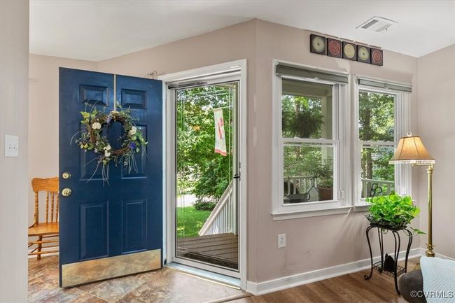 Foyer with plenty of natural light, baseboards, and wood finished floors | Image 6