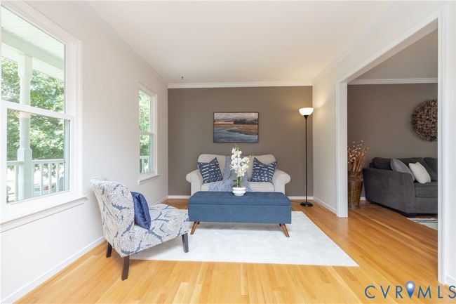 Sitting room featuring wood finished floors and crown molding | Image 7