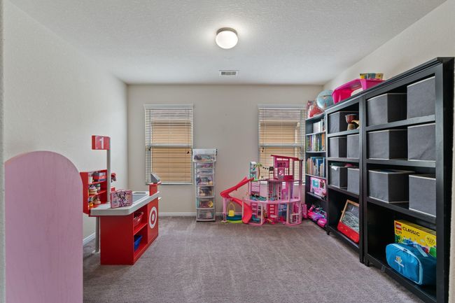 Across from the media is the home office that is currently being used as a play room. | Image 31