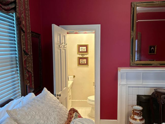 Bathroom with tile patterned floors and toilet | Image 6