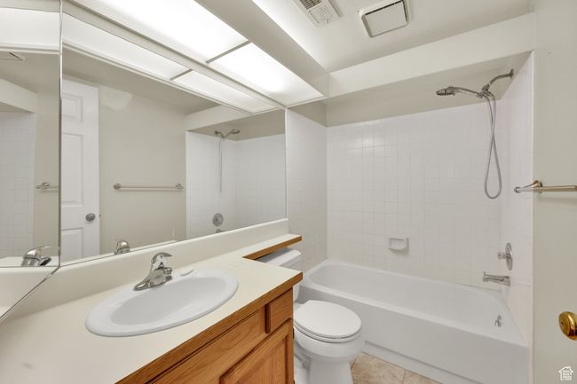 Full bathroom with vanity, shower / washtub combination, and tile patterned floors | Image 7