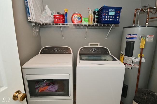 laundry room with water heater and independent washer and dryer | Image 27