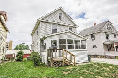 Back of house with a lawn | Image 2