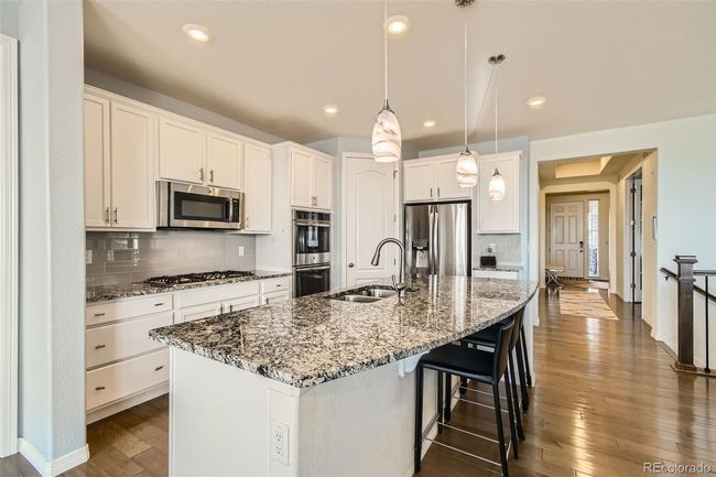 Stainless steel appliances and double ovens. | Image 5