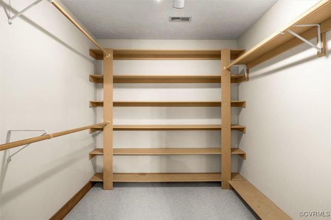Spacious closet featuring carpet | Image 45