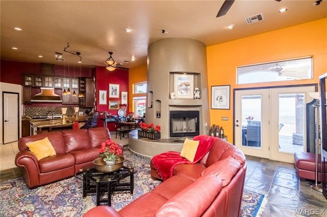 Living room with ceiling fan, recessed lighting, and a fireplace | Image 62