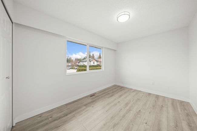 Empty room featuring baseboards, visible vents, and light wood-style floors | Image 16