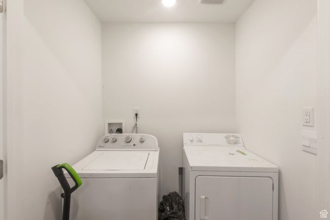 Laundry room with washing machine and clothes dryer | Image 14