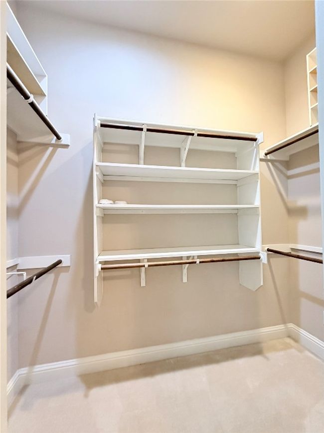 Walk in closet with carpet floors | Image 33