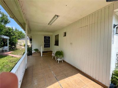 View of covered front porch & patio | Image 2