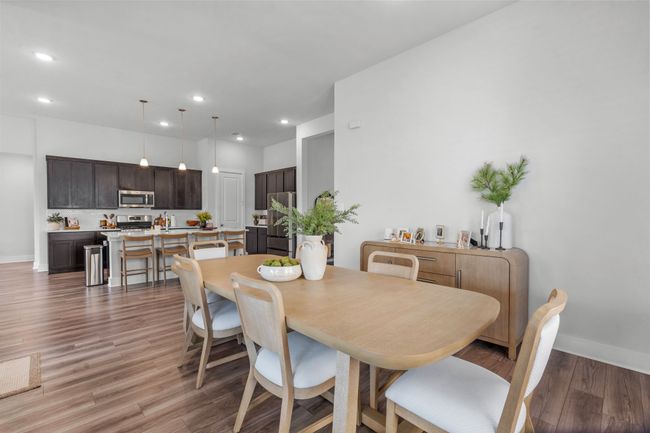 Dining room with recessed lighting and light wood finished floors | Image 19