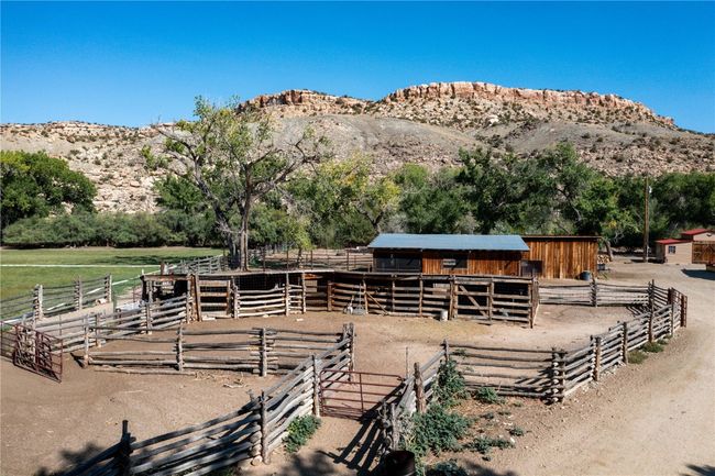 View of horse barn featuring a mountain view and a rural view | Image 7