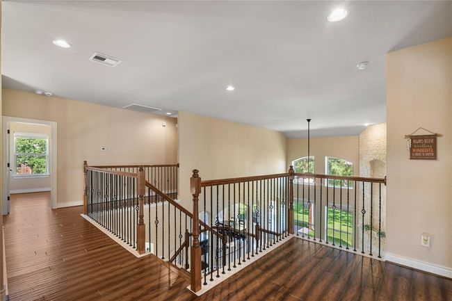 Coming upstairs you can admire the distinctive hand-railing with an open view of the home. | Image 23