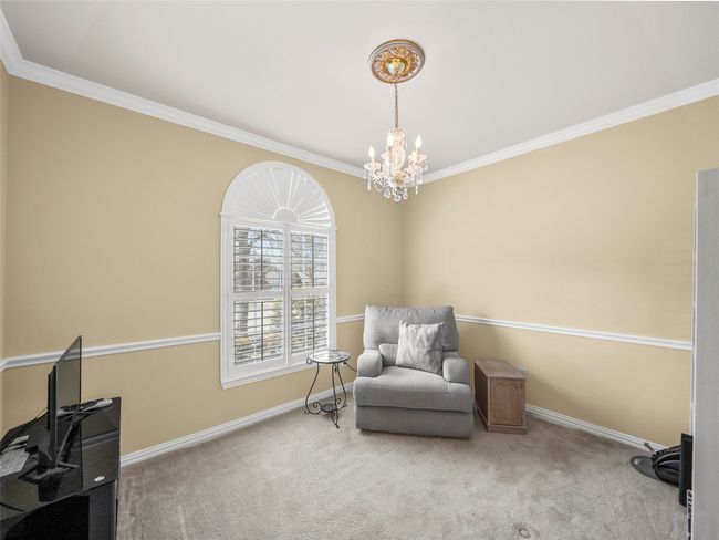 Living area featuring baseboards, carpet flooring, and ornamental molding | Image 4