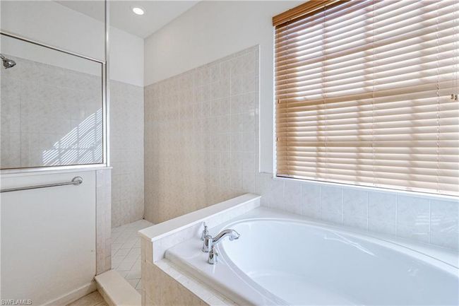 Bathroom with independent shower and bath and a healthy amount of sunlight | Image 35