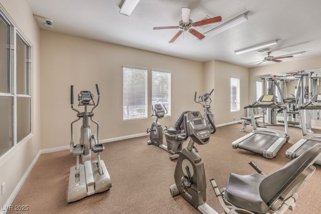 Gym featuring visible vents, baseboards, and a ceiling fan | Image 35
