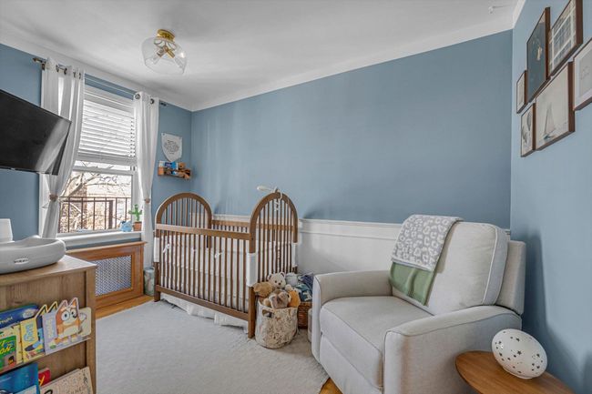 Bedroom with a nursery area | Image 8