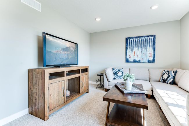 A great space to gather for family game or movie night! Photo of model home, color and options will vary. | Image 24