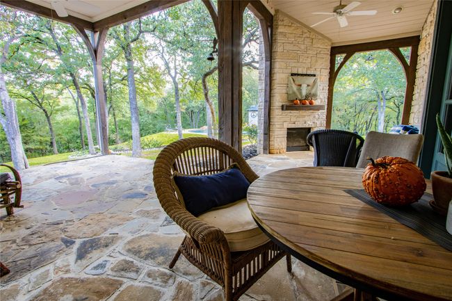 View of patio featuring outdoor dining area and ceiling fan | Image 22