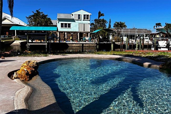 View of swimming pool facing the canal | Image 19