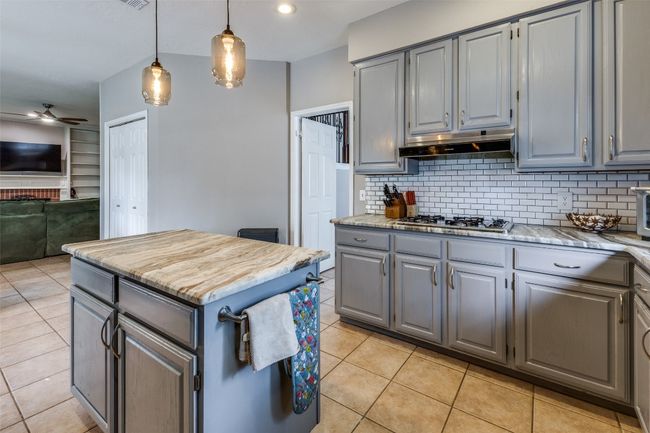 Large island and gas range/built in gas stove. | Image 9