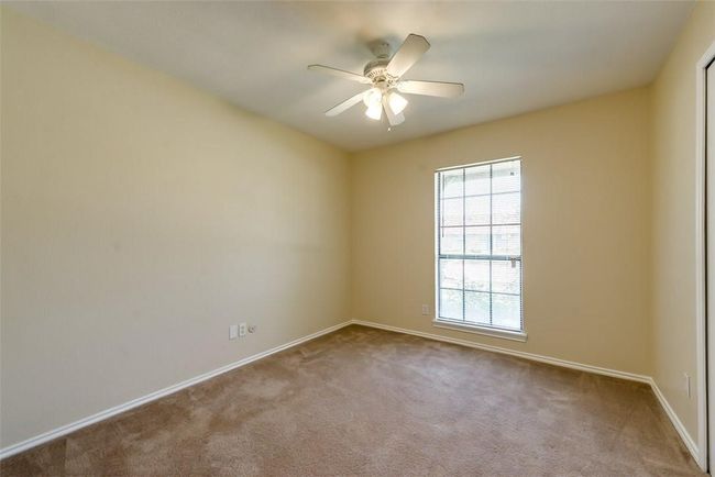 Unfurnished room with baseboards, carpet floors, and a ceiling fan | Image 14