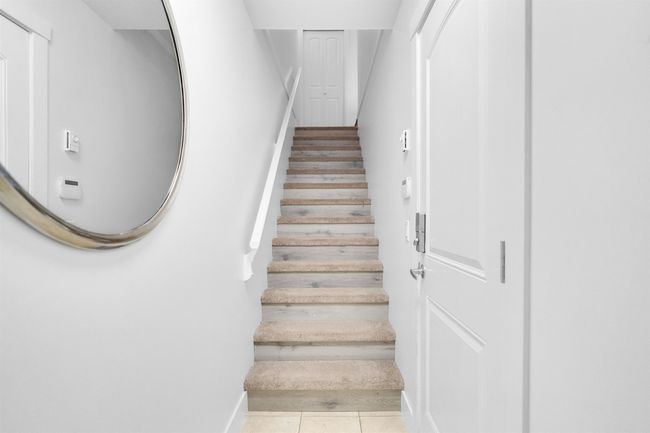 Staircase with tile patterned floors | Image 5