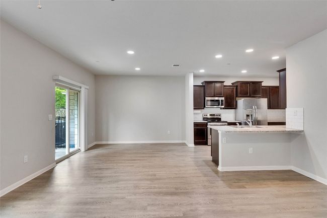 Light, bright and open to kitchen, dining and living space. | Image 5