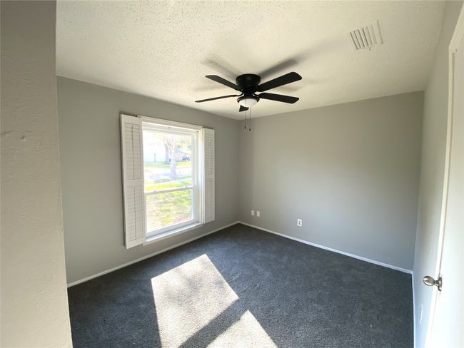 One of three secondary bedrooms. | Image 9