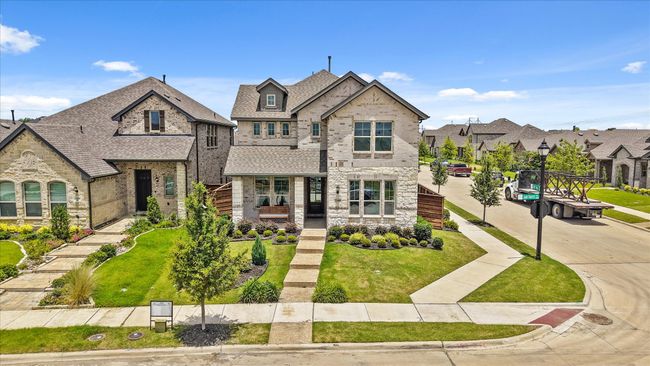 View of front of property with brick siding, a residential view, a front yard, stone siding, and a shingled roof | Image 36