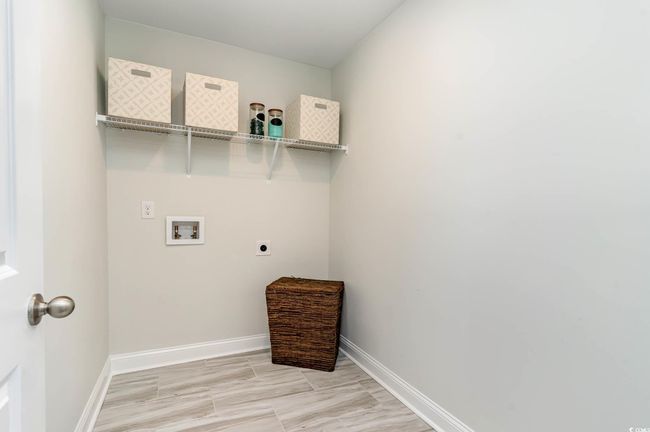 Laundry room with electric dryer hookup and hookup for a washing machine | Image 24