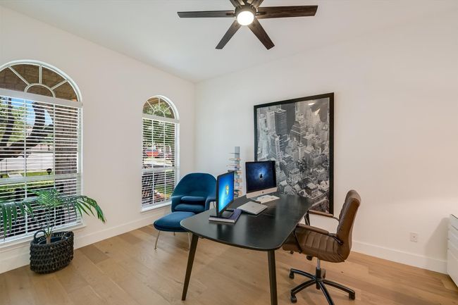 Home office with baseboards, wood finished floors, and ceiling fan | Image 13