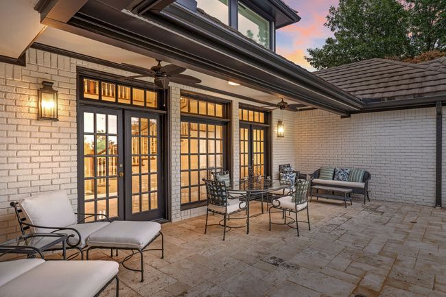 Large patio with exterior lighting and ceiling fans | Image 32