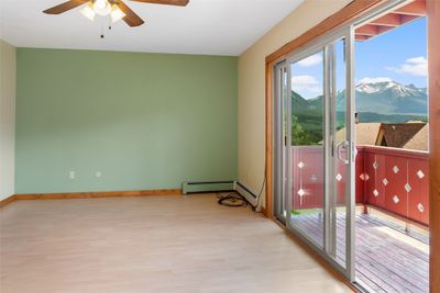 Open living room/kitchen with plentiful natural light and great mountain views! | Image 2