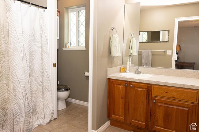 Bathroom with vanity and tile patterned floors | Image 14