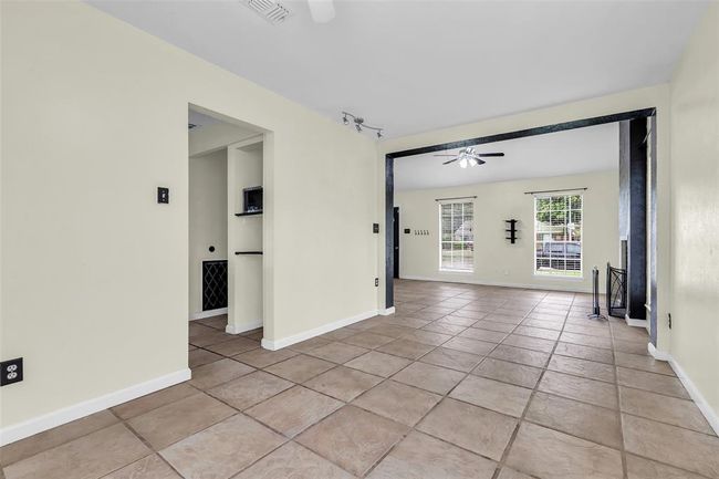 A view from the dining room reveals the open, empty spaces—ready for your personal touch and furnishings. | Image 12