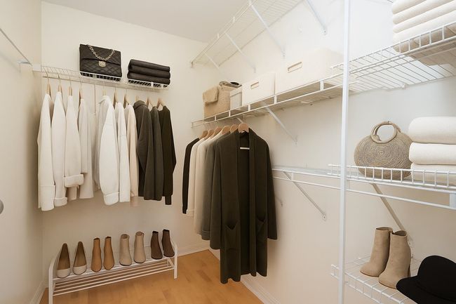 Walk in closet featuring wood finished floors | Image 8