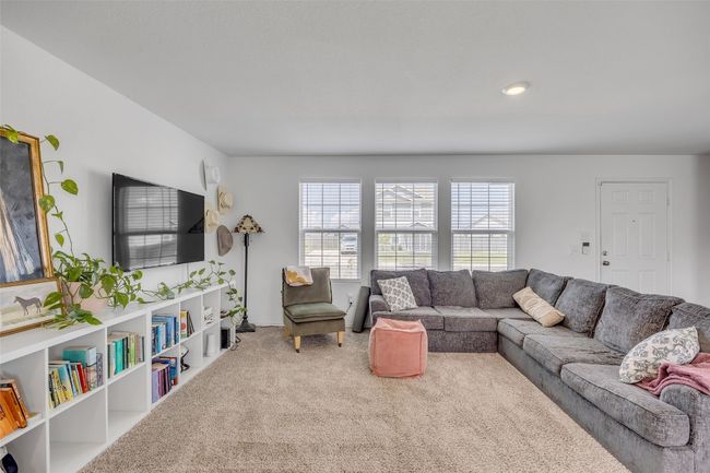 Living room featuring carpet floors and healthy amount of natural light | Image 10